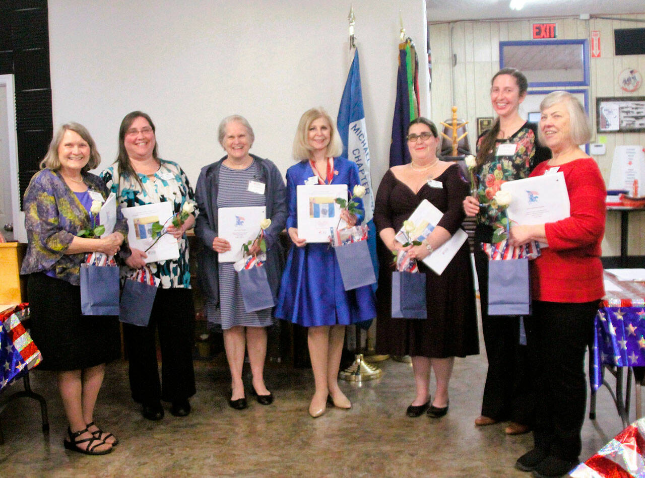 Pictured, left to right, are new members Lynne Petitjean, Jennifer De Cou, Grace Kauffman, Cherie Kidd, Gwynn Oden, Amanda Patterson, and Ilene Rogers. (Darlene Cook/Michael Trebert Chapter, DAR)