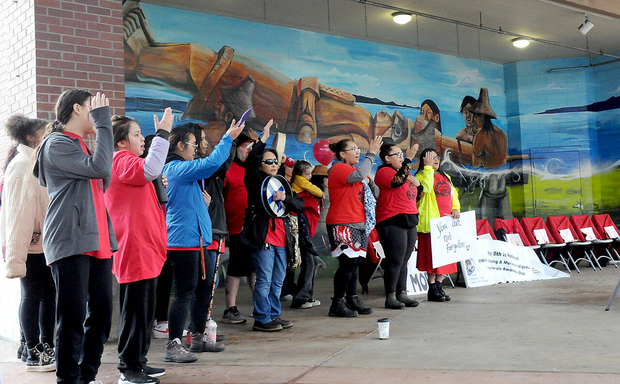 Singers from the Lower Elwha Klallam Tribe and others sing during a commemoration of National Day of Awareness for Missing and Murdered Indigenous Women and Girls on Friday at The Gateway in downtown Port Angeles. (KEITH THORPE/PENINSULA DAILY NEWS)