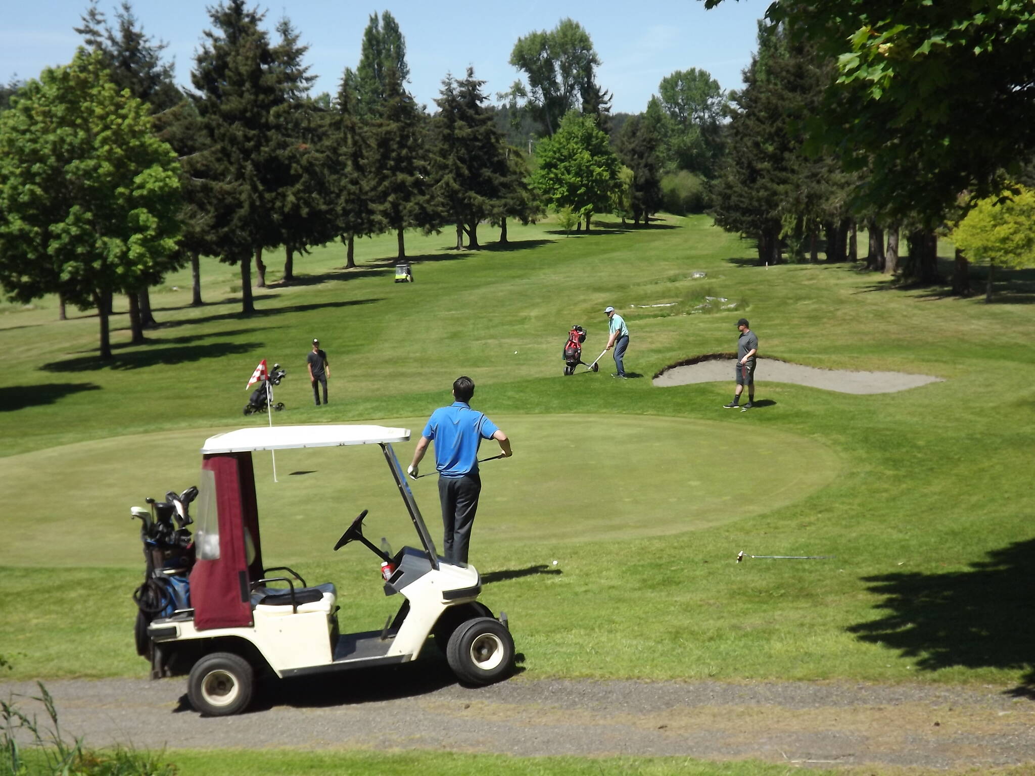 Port Townsend Golf Club
Golfers in the 2021 Rhody Open Golf Tournament watch a chip shot on the ninth hole at Port Townsend Golf Club.