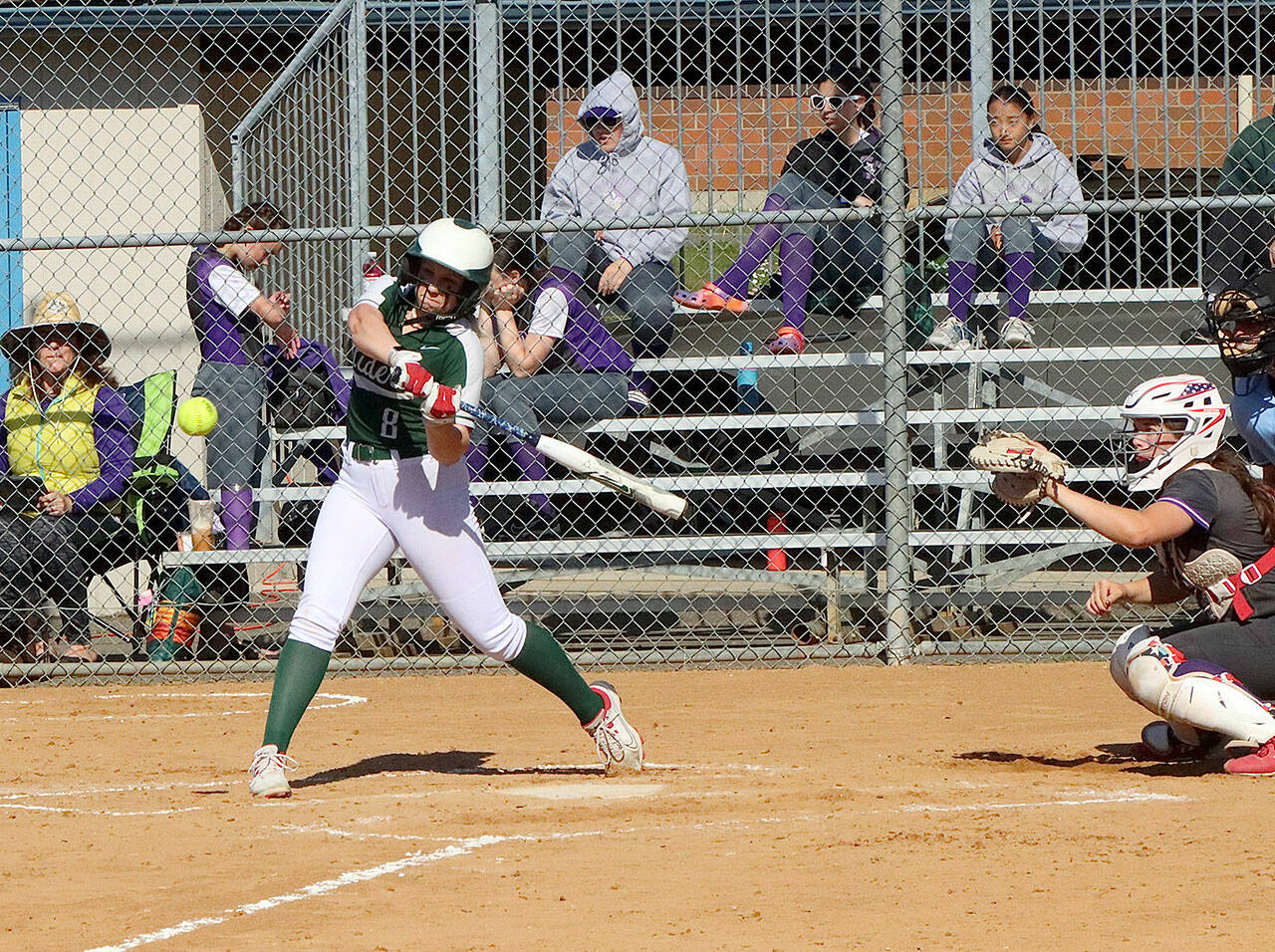 Dave Logan/for Peninsula Daily News Port Angeles’ Heidi Leitz connects on a solo home run during the Roughriders 7-5 loss to North Kitsap at Dry Creek Elementary on Thursday.