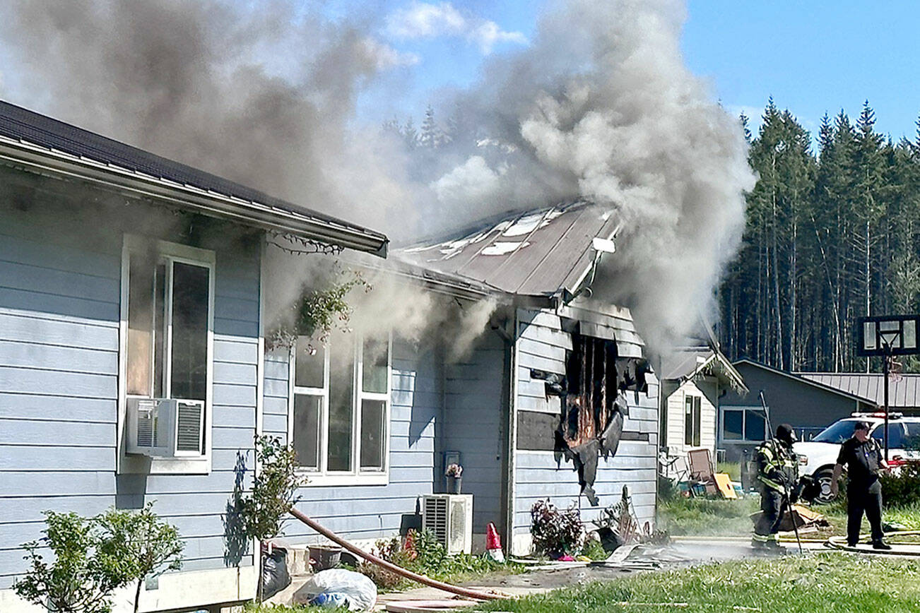 Clallam 2 Fire-Rescue firefighters battle a blaze on Killer Whale Lane. (Clallam 2 Fire-Rescue)