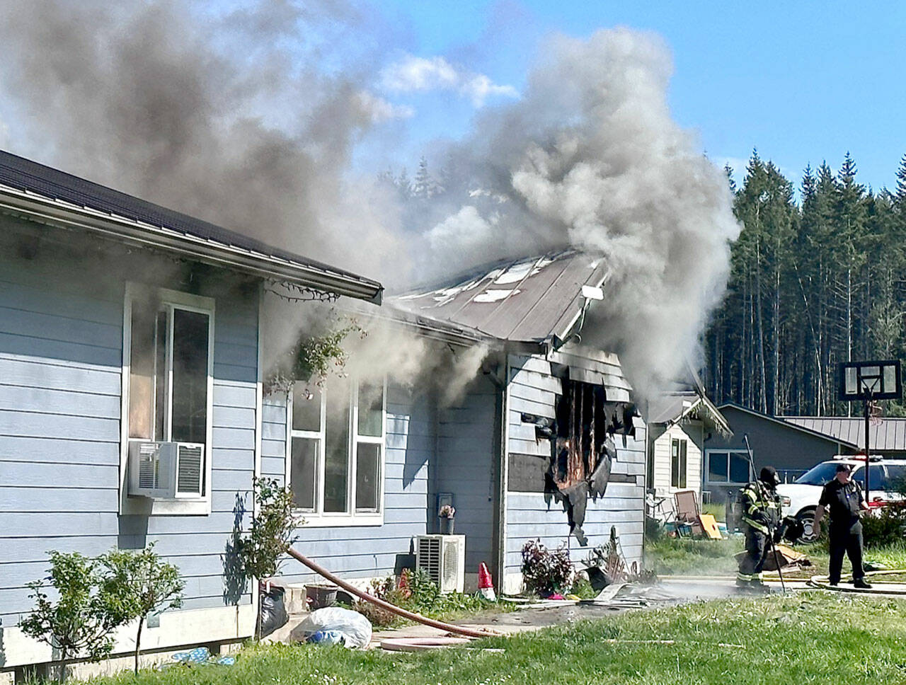 Clallam 2 Fire-Rescue firefighters battle a blaze on Killer Whale Lane. (Clallam 2 Fire-Rescue)