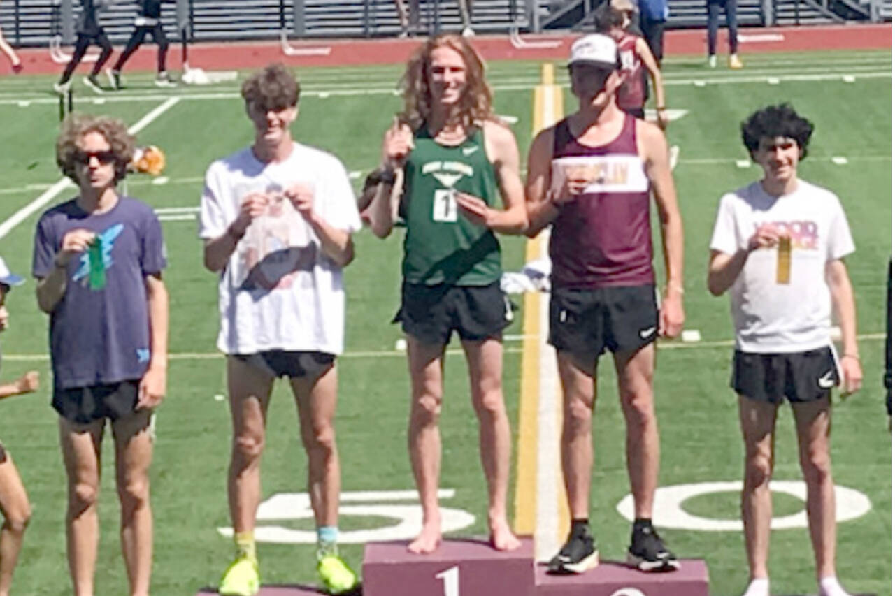 Port Angeles’ Jack Gladfelter celebrates winning the 1,600 District 2/3 championship this weekend at Renton Stadium. He also won the 3,200 district championship. (Joe Gladfelter)