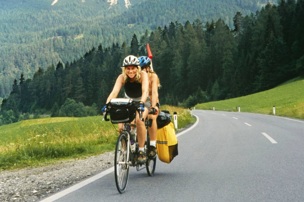 Paula and Anya Eber cycle over the Alps. The Eber family, who were featured in a Traveler’s Journal in March, will detail their 14,931-kilometer, around-the-world fundraiser adventure on tandem bicycles at the Northwest Tandem Rally on Sunday in Sequim. (Eber family)