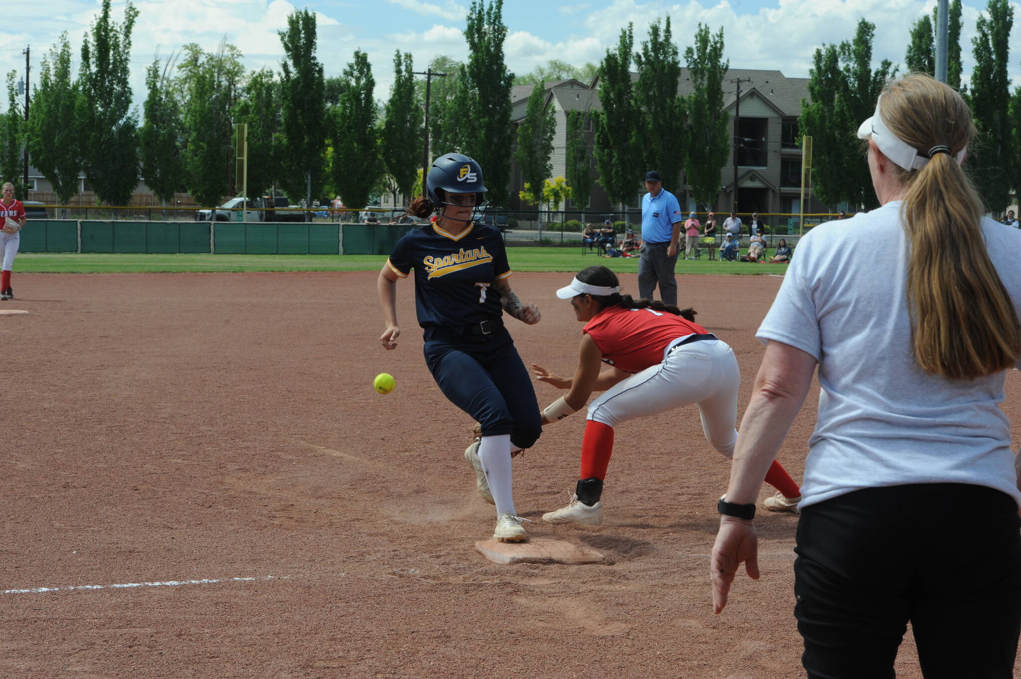 Lonnie Archibald/for Peninsula Daily News Forks’ Haven Hofman steals third base standing up in the Spartans’ 13-5 win over the Brewster Bears.