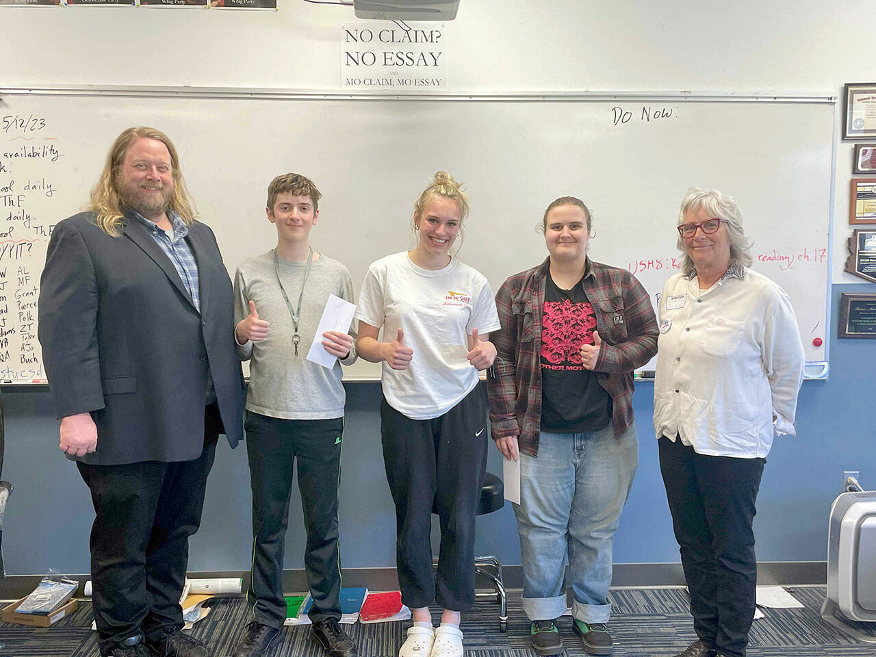 Pictured, left to right, are Chimcum High School teacher Brian MacKenzie, Keanu Morrison Tessa Richardson, Elliot Pflueger and League of Women Voters essay team organizer, Jackie Aase.