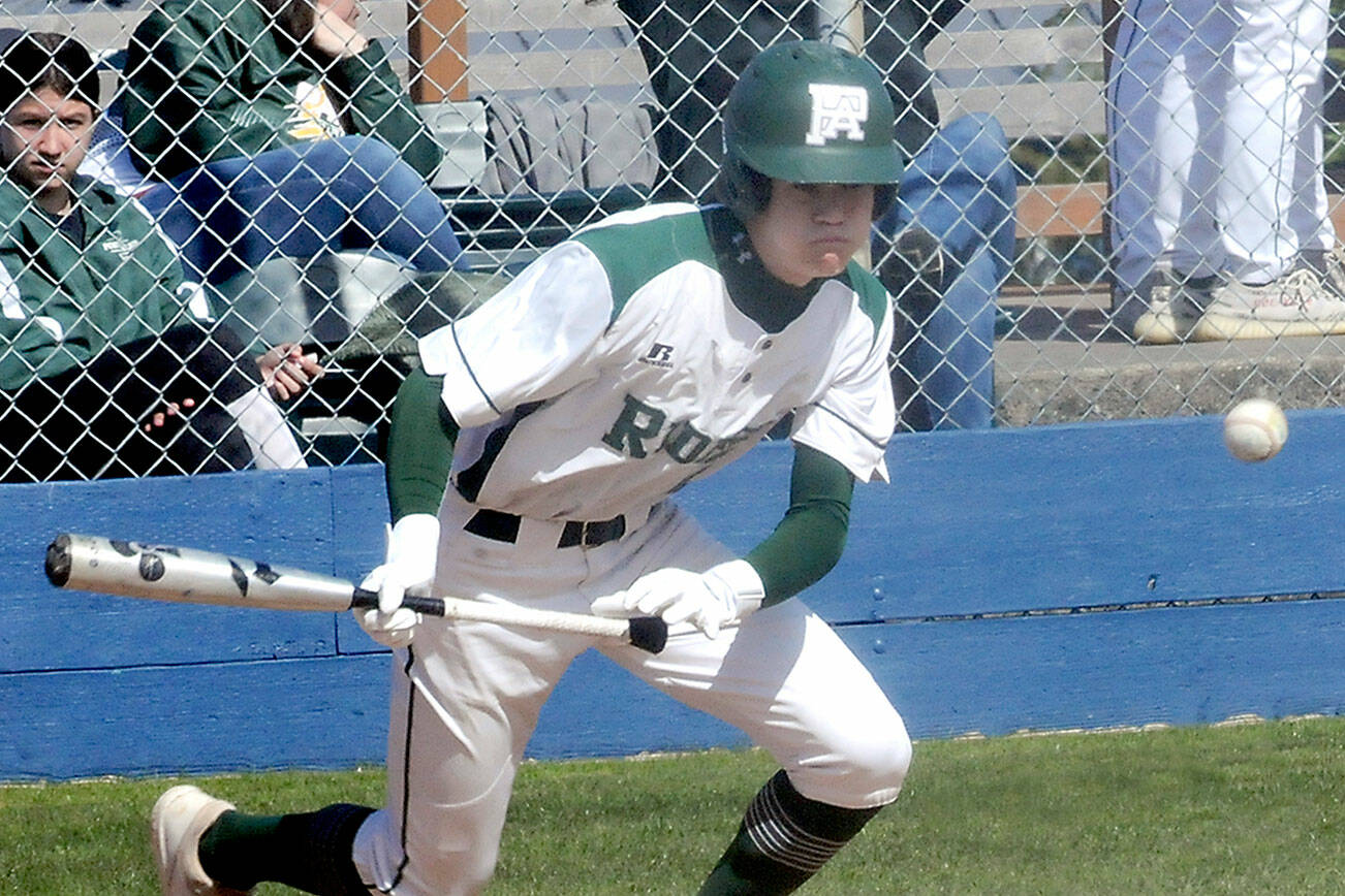 KEITH THORPE/PENINSULA DAILY NEWS
Port Angeles' Alex Angevine bunts to advance the baserunners in the second inning against South Whidbey on Tuesday at Port Angeles Civic Field.