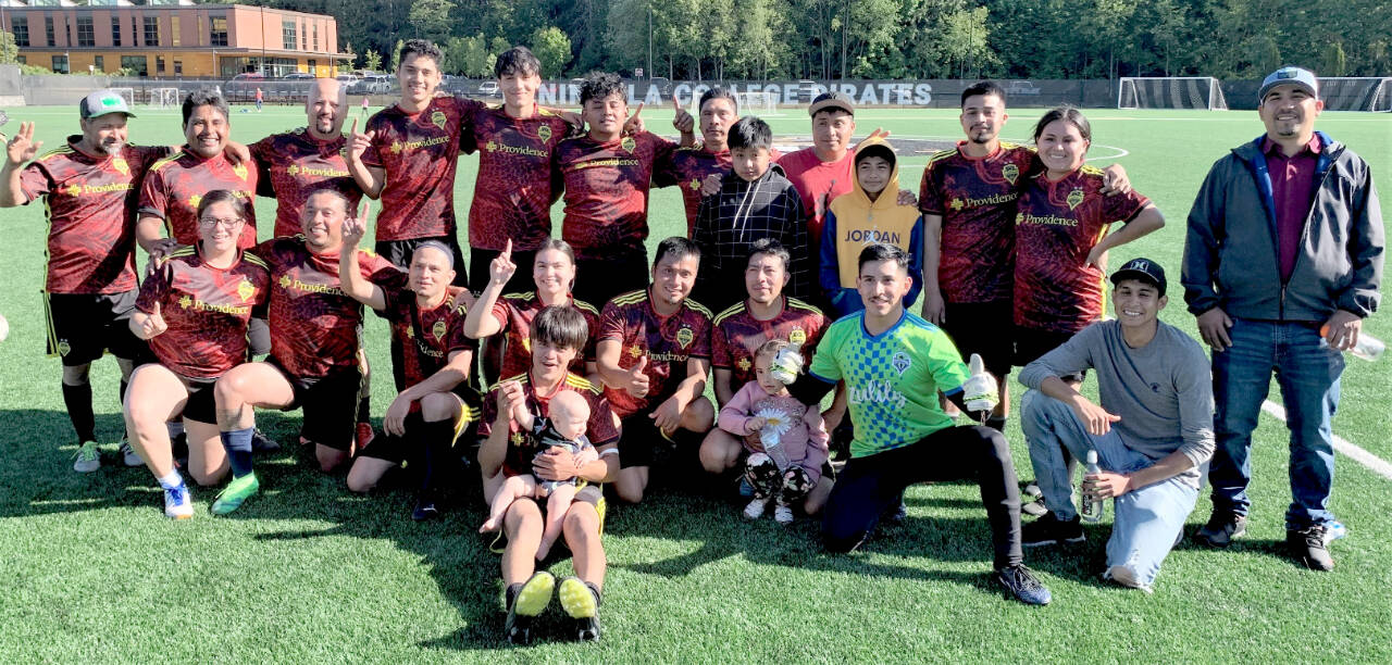 The Forks Football Club won the Peninsula Soccer League champion. In front is Hugo Sandoval II (holding Hugo Sandoval III). From left, second row, are Janessa Ramos, Julio Maroto, Hugo Sandoval I, Candida-Rose Sandoval, Gabriel Julio, Aurelio Garcia (holding Natalia Garcia) and German Camacho. From left, third row, are Costa Cendejas, Javier Julio, Jose Cendejas, Dani Jimenez, Jesus Gonzalez, Luis Perez, Sebastian Thomas Pedro, Carmelo Julio Jr., Carmelo Julio Sr., Brian Garcia, Ernesto Julio and Chenoa Black. Missing are Leslie Beltran are Miley Blanton. (Rick Ross photo)