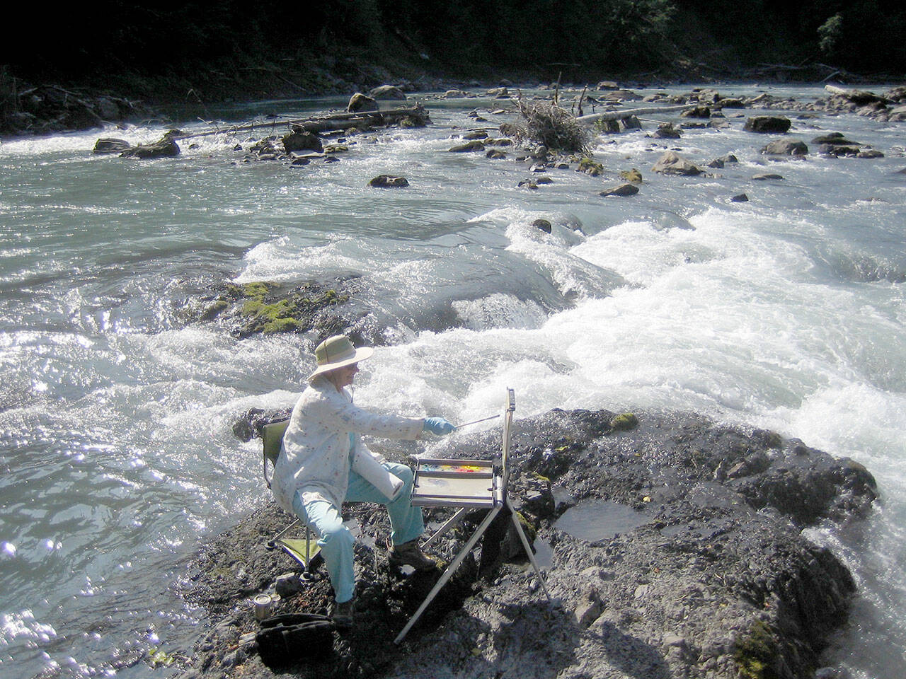 Northwind Art will host a plein air painting exhibition later this summer in tribute to the late Kathy Francis of Port Townsend, pictured here at the oxbow of the Hoh River. Artists are invited to enter work through July 14. (photo courtesy of Bob Francis)