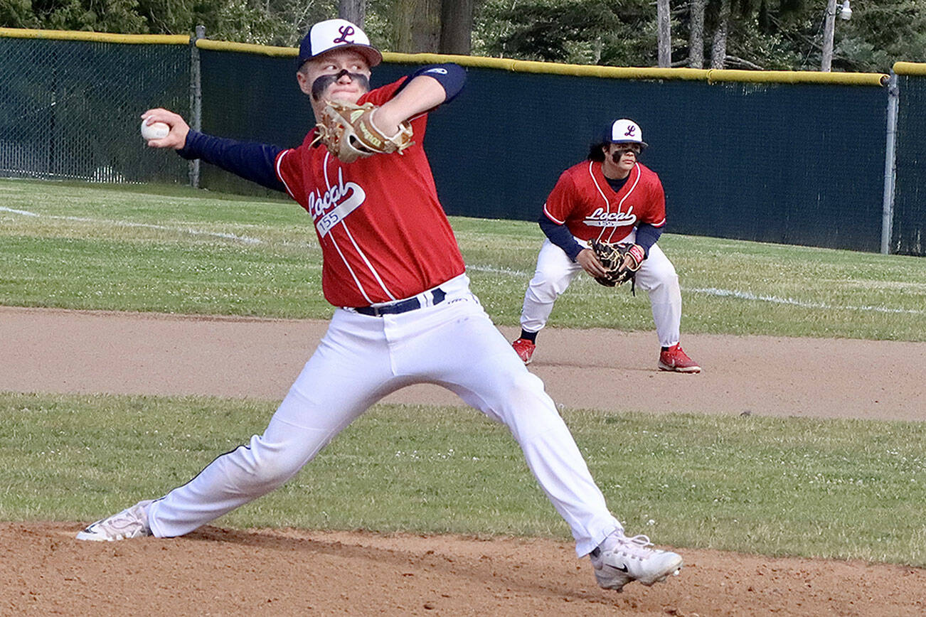 Brandt Perry pitches for Local 155 in the Olympic Junior Babe Ruth championship game against Athletes Choice on Thursday night at Volunteer Field. Playing first base is Chris Jaynes. It was a pitchers' duel as the game went into extra innings. Local 155 ended up winning 3-2 on a walk-off, finishing the season 13-1. (Dave Logan/for Peninsula Daily News)