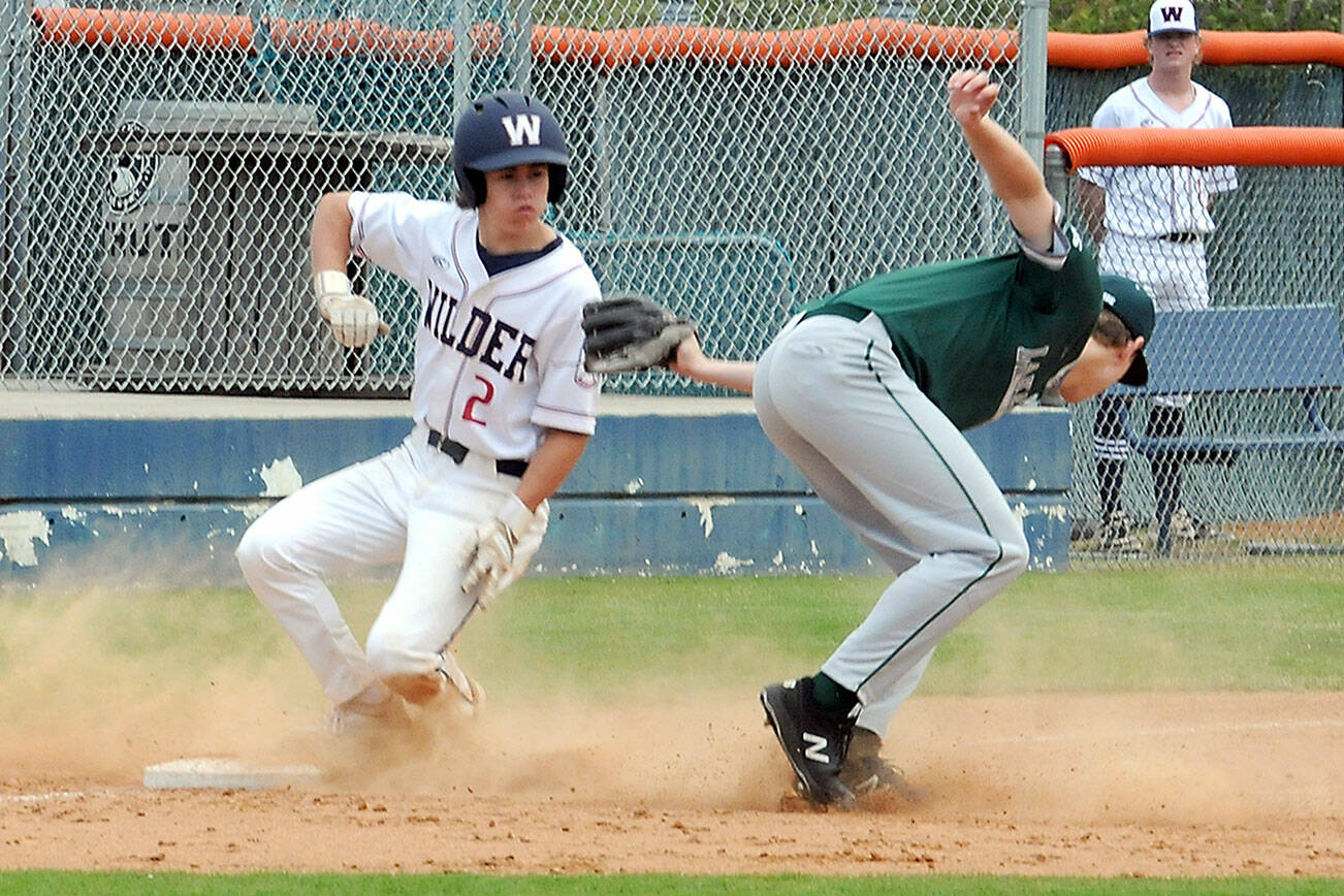 KEITH THORPE/PENINSULA DAILY NEWS
Wilder Senior's Alex Angevine, left, makes it to third as Lakeside Recovery Senior third baseman Carter DuBreuil struggles with an errant throw on Saturday afternoon at Port Angeles Civic Field.