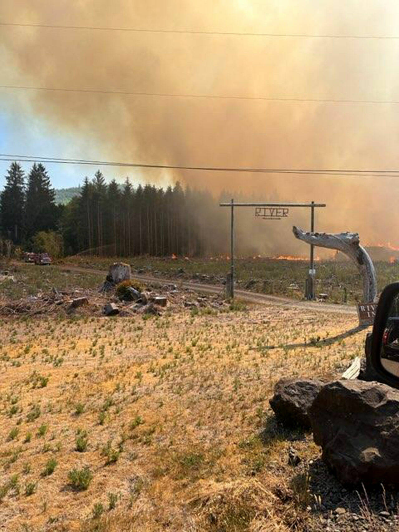 A growing brush fire has burned at least one structure and forced the cancellation of fireworks in Forks. (Clallam County Fire District 1)