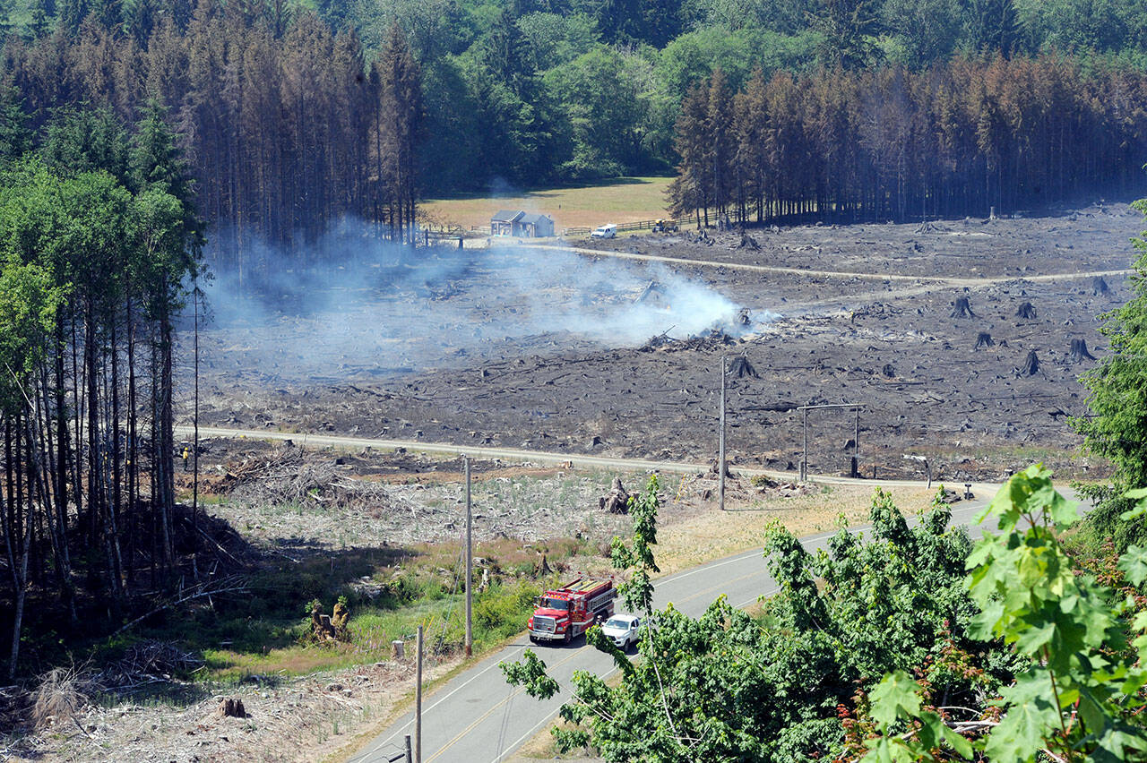 A burnt area is seen from a logging road near Valley View residential housing along Bogachiel Way west of Forks. The fire started Tuesday afternoon. Its cause was unknown. (Lonnie Archibald/for Peninsula Daily News)
