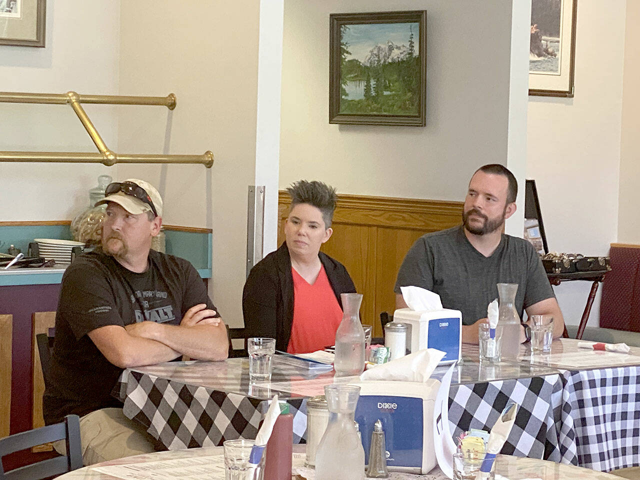 Speaking at a candidate forum on Thursday were, from left, Mark Karjalainen, Navarra Carr and Nick Merrigan. (Ken Park/Peninsula Daily News)