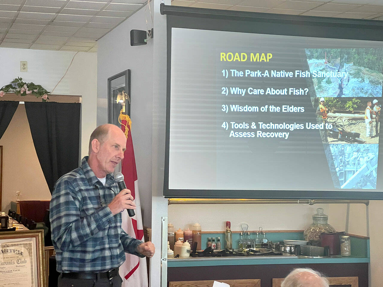 Sam Brenkman, chief fisheries biologist for Olympic National Park, speaks about fish restoration on the Elwha River following the removal of two dams during a meeting of the Kiwanis Club of Port Angeles at Joshua’s Restaurant on Thursday. (Peter Segall/Peninsula Daily News)