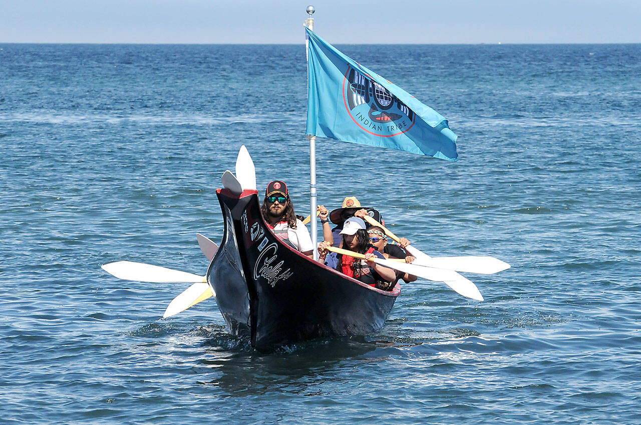 A canoe representing the Hoh Tribe approaches the beach on Lower Elwha Klallam territory on Sunday. Canoe teams will set out Tuesday for their next stop at Jamestown Beach near Sequim for an overnight stay hosted by the Jamestown S’Klallam Tribe. Pullers arriving in Port Townsend on Wednesday will greeted by representatives of the Lower Elwha, Jamestown and Port Gamble S’Klallam tribes. (Keith Thorpe/Peninsula Daily News)