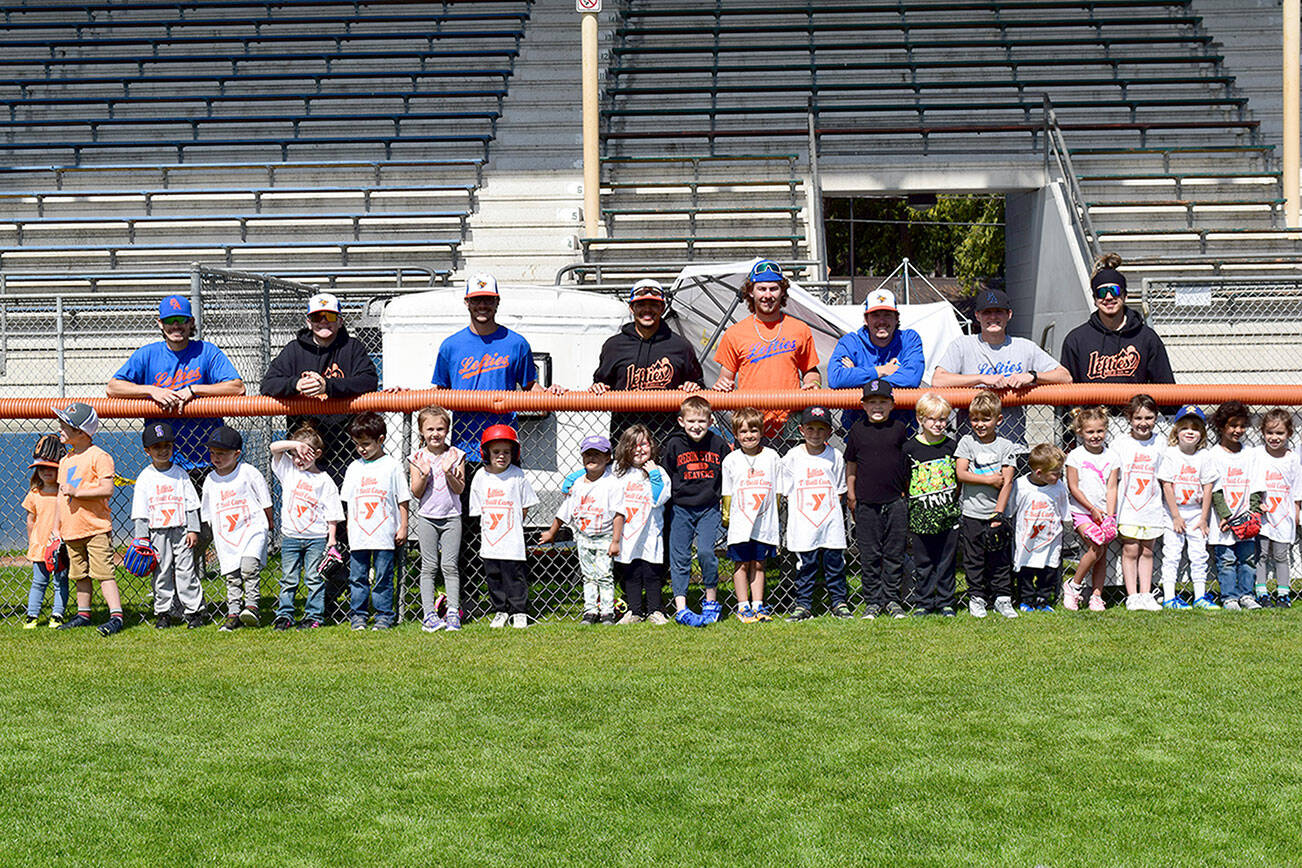 Erin Hawkins/Olympic Peninsula YMCA 

Port Angeles Lefties players volunteered to teach fundamental baseball skills at a YMCA of Port Angeles-sponsored T-ball camp for 45 young ball players July 25-27 at Civic Field.