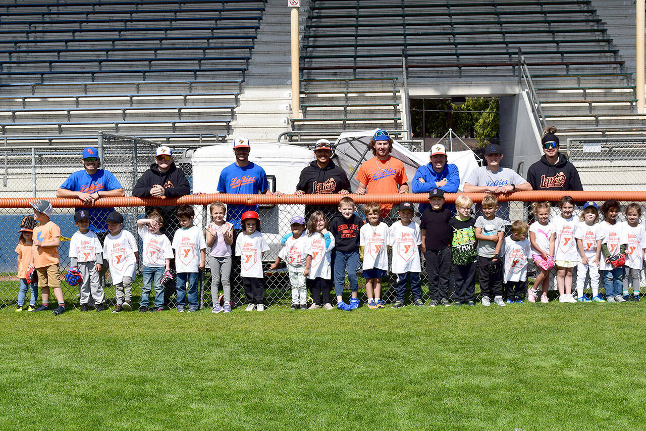 Erin Hawkins/Olympic Peninsula YMCA
Port Angeles Lefties players volunteered to teach fundamental baseball skills at a YMCA of Port Angeles-sponsored T-ball camp for 45 young ball players July 25-27 at Civic Field.