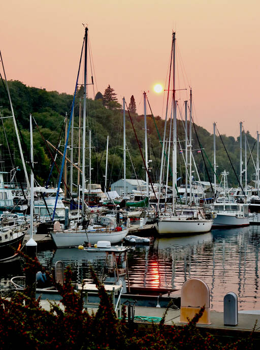 A smoky haze seen from Port Angeles Boat Haven from wildfires in eastern Washington and Canada affected air quality in the North Olympic Peninsula on Sunday. The National Weather Service said Monday that westerly winds should help clear out the smoke and lead to clear conditions. (Dave Logan/for Peninsula Daily News)