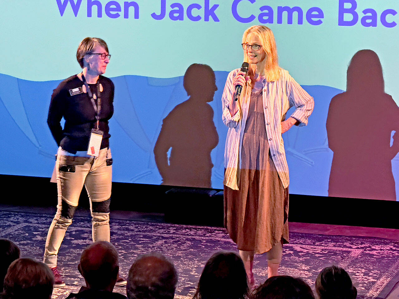 Actress Lindsey Wagner, right, with Port Townsend Film Festival Program Director Christy Spencer, stands on stage at Key City Public Theater in Port Townsend on Saturday to introduce the film, “When Jack Came Back,” one of the entrants in the 2023 film festival that stars Wagner as a mother in the grip of Alzheimer’s Disease. (Steve Mullensky/for Peninsula Daily News)