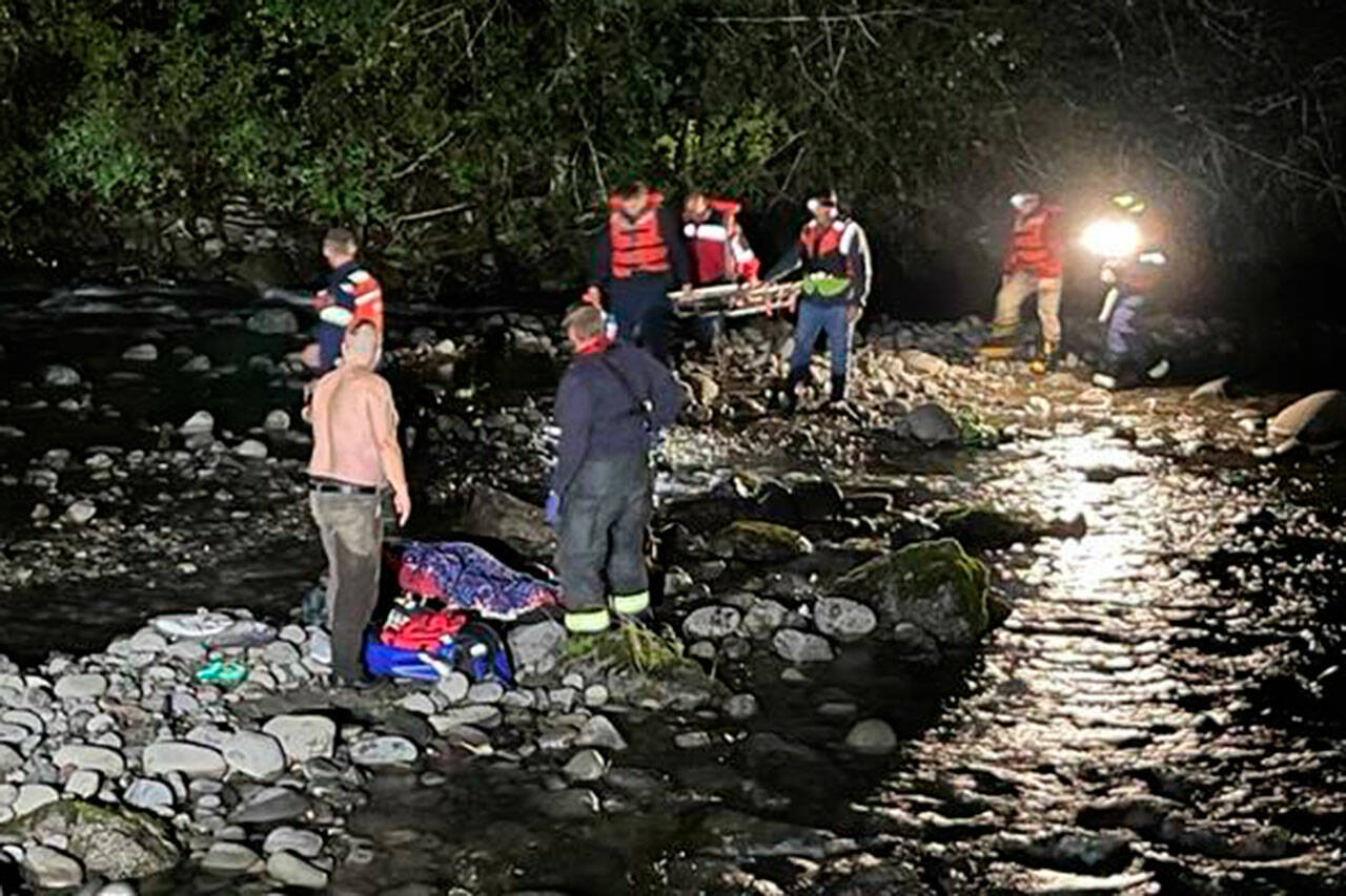 Clallam County Fire District 3 conducts a rescue on Thursday for an injured teenager in the Dungeness River. (Chris Turner)