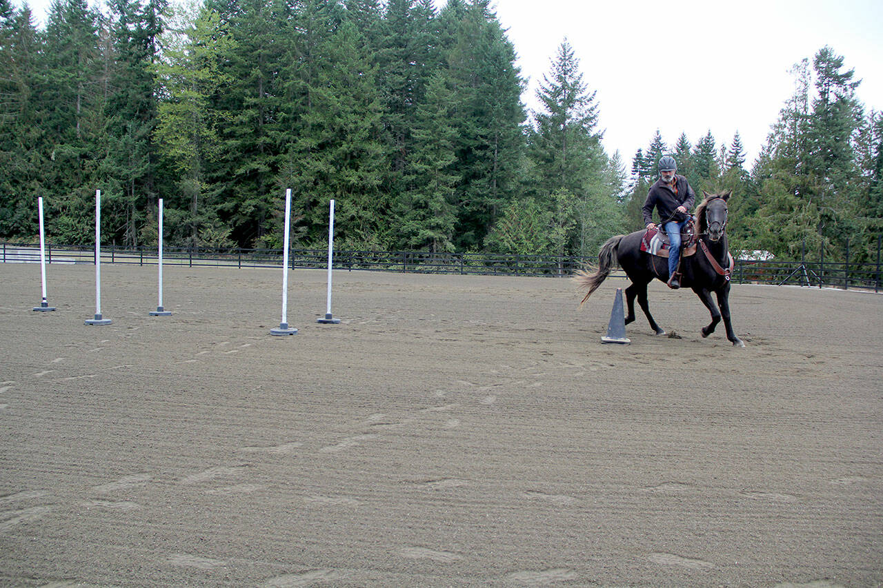 New rider Paul Eyestone, riding a horse borrowed from OPEN co-founder Diane Royall, did an excellent job learning how to communicate with the horse during the fun fundraiser and Western games playday at the 4L arena Sept. 23. (Karen Griffiths/for Peninsula Daily News)