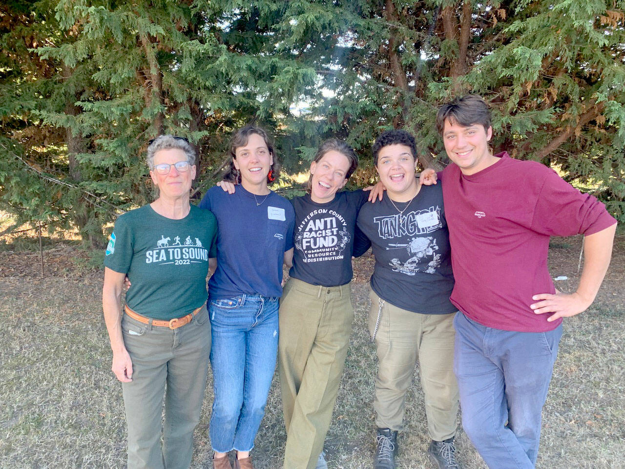 Pictured, from left to right, are SisterLand Farms volunteers Emily Marcus, Sammi Grieger, and Farmers Jenson, Eli Smith and Benji Astrachan at the North Olympic Land Trust Harvest Dinner. SisterLand Farms, located in Port Angeles, was named Farmer of the Year by NOLT for their work in the community. (Courtesy photo / Katrina Shelby, SisterLand Farms)