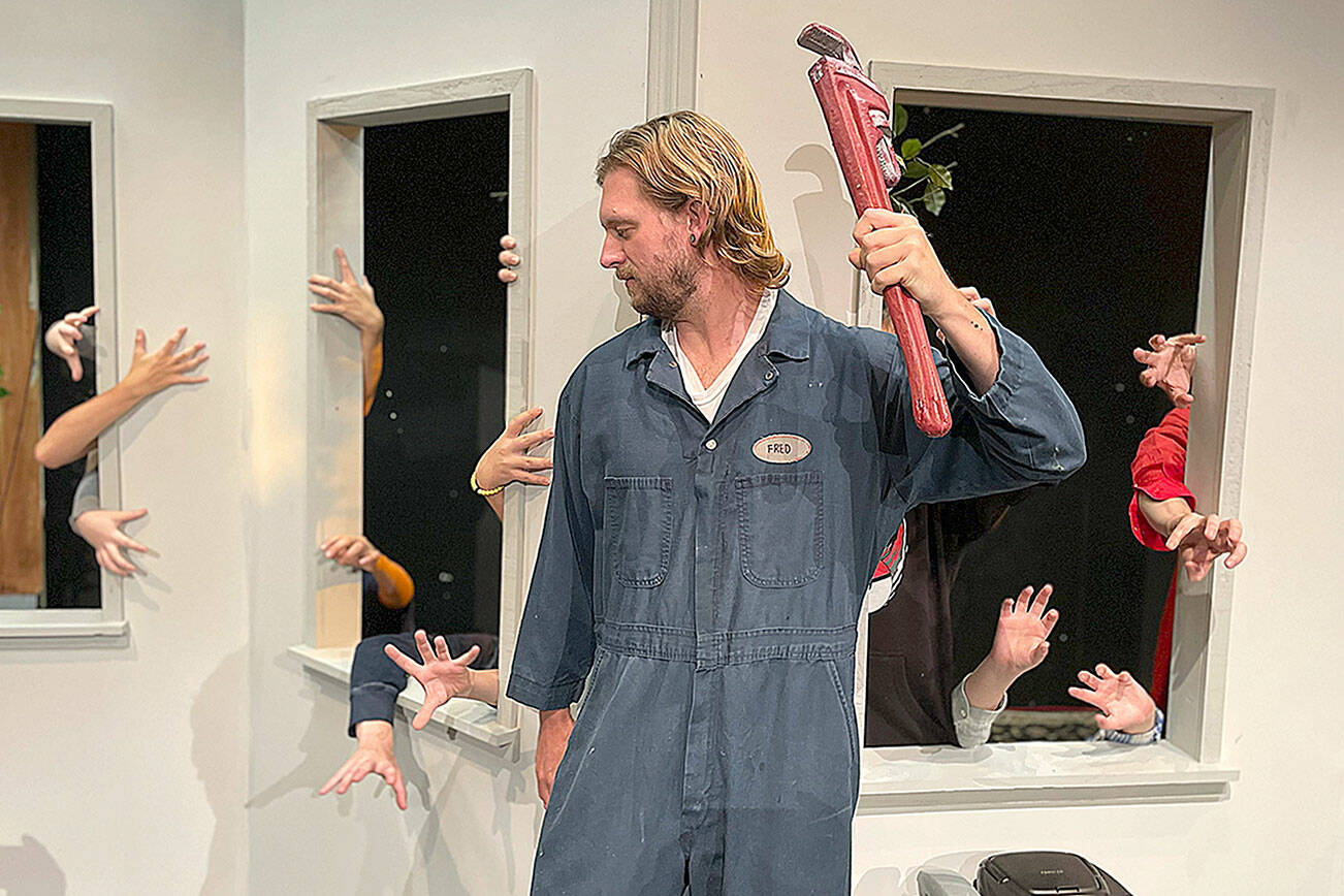 Matthew Nash/Olympic Peninsula News Group 

Justin Stapleton, as Ben, attempts to survive a horde of zombies coming through the windows in Olympic Theatre Arts’ “Night of the Living Dead.” The OTA show opens tonight and runs through Halloween evening.