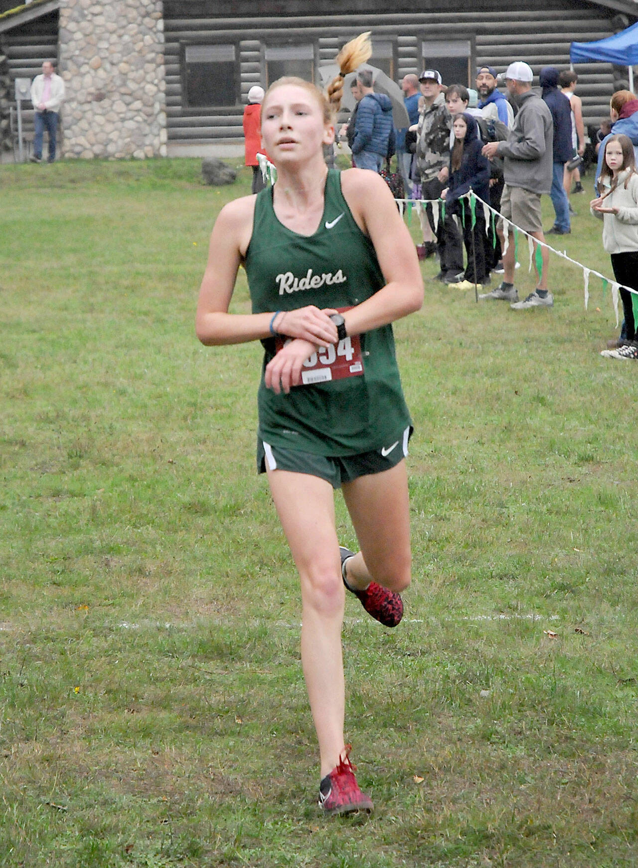 KEITH THORPE/PENINSULA DAILY NEWS Leia Larson of Port Angeles takes thrid place in Thursday’s Olympic League Championships at Lincoln Park.