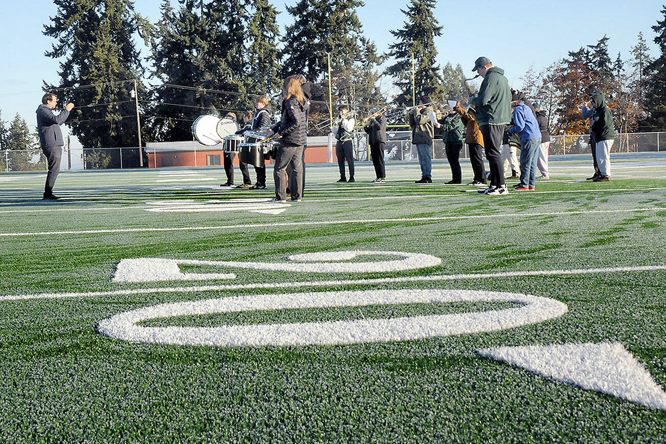 Members of the Port Angeles High School Band perform on the new pitch during Saturday’s dedication ceremony for the Port Angeles School District’s Monroe Athletic Field. (Keith Thorpe/Peninsula Daily News)