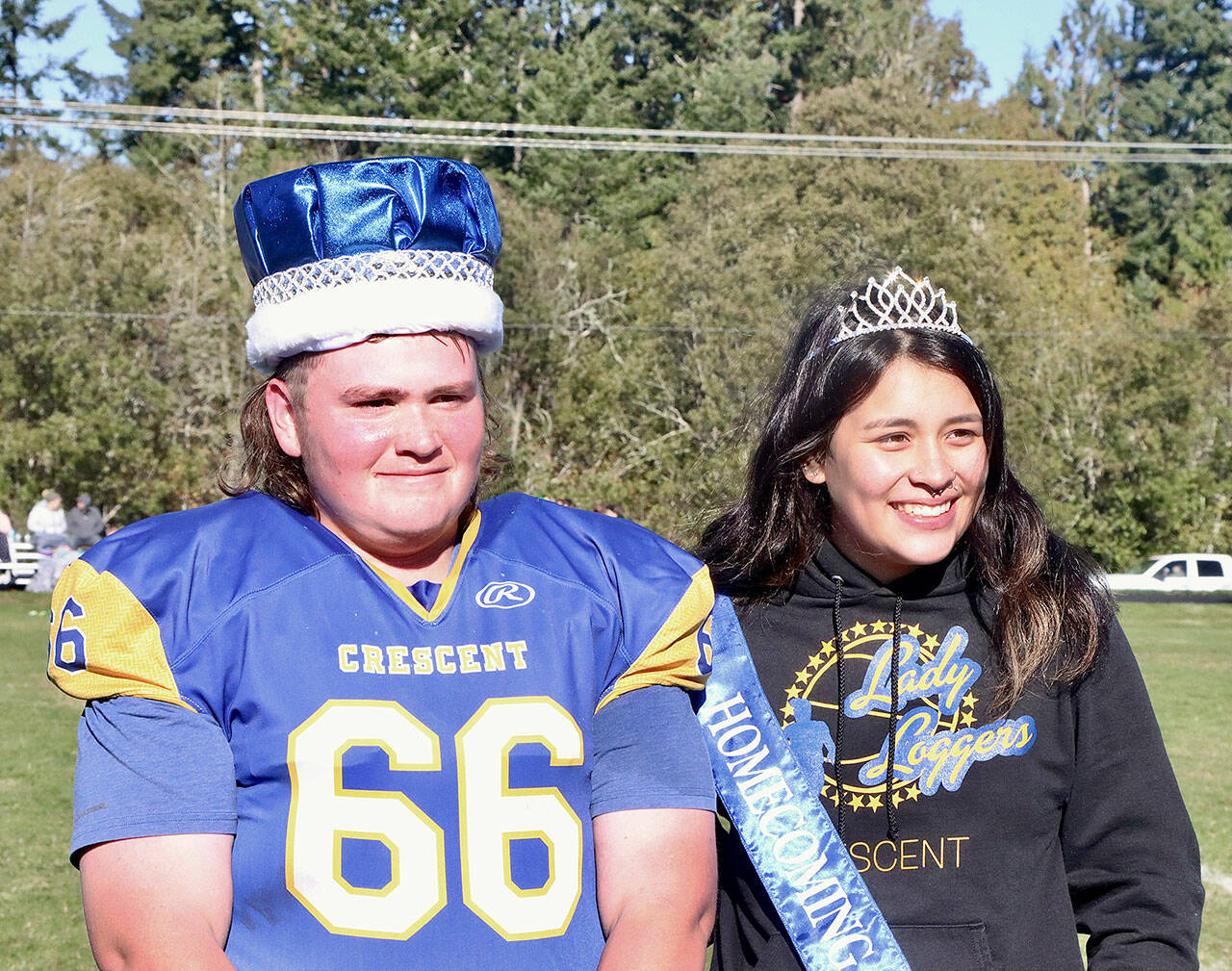King Wyatt Owens, a lineman for the Crescent High School football team, left, and Queen Ciara Cargo were named homecoming royalty at halftime of the Loggers’ game against Darrington on Saturday. Both are seniors at the school. (Dave Logan/for Peninsula Daily News)