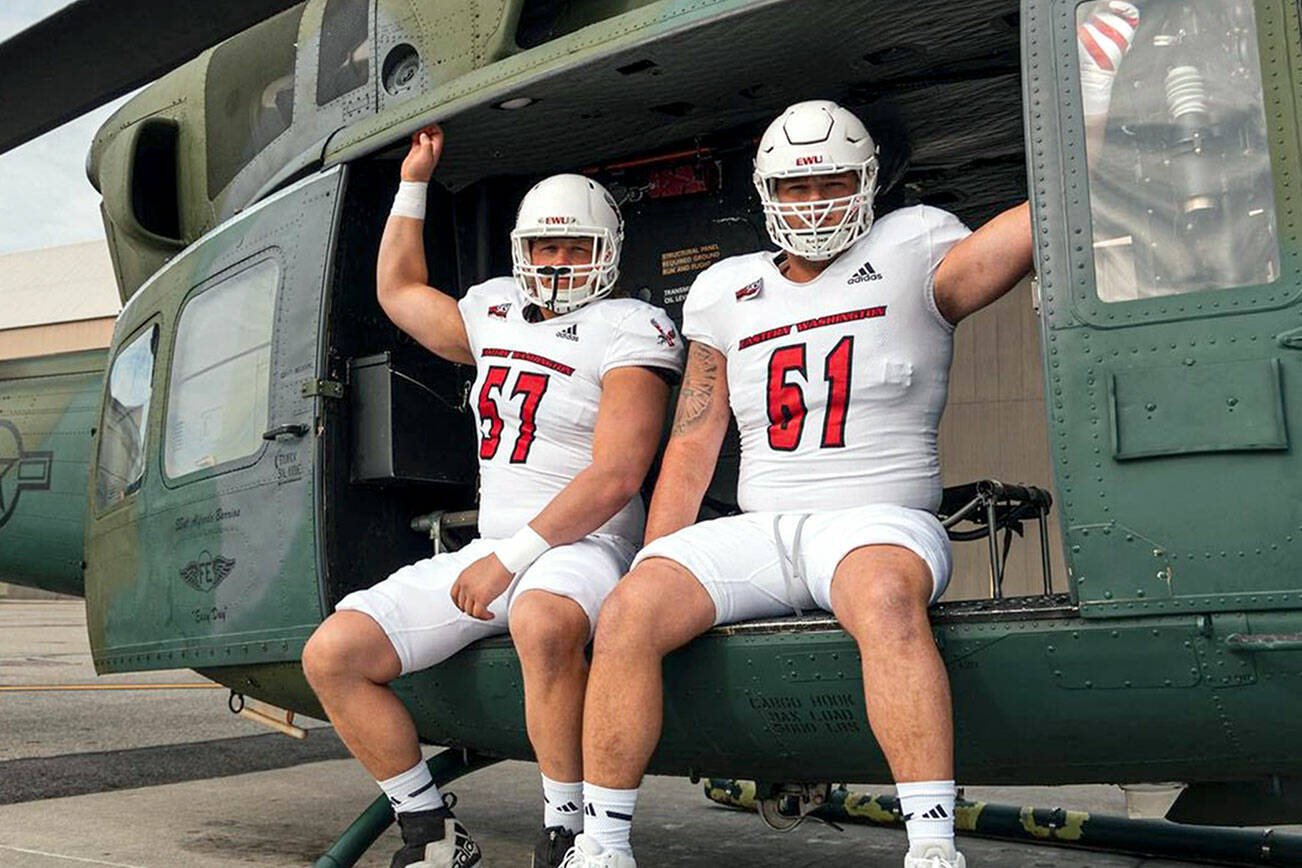 Eastern Washington Football
Forks' Luke Dahlgren, left, and offensive line teammate Wyatt Hansen are featured in the Eastern Washington football program's uniform reveal ahead of today's "White Out" home game against Cal Poly. The pair are pictured in a helicopter at Spokane's Fairchild Air Force Base.