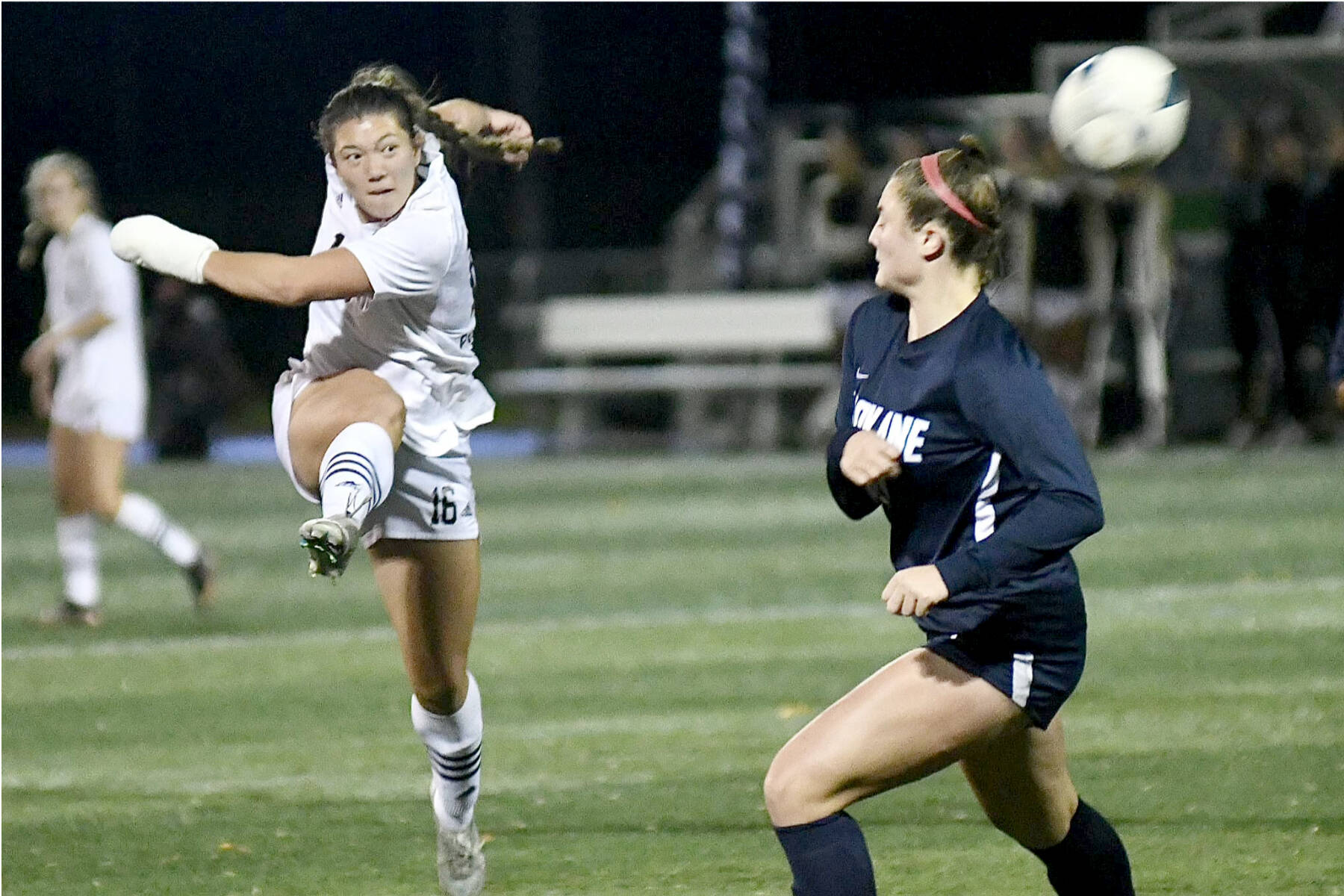 Shawna Larson (16), playing with a broken hand, gets off a shot Friday night in the NWAC semifinals. (Jay Cline/Peninsula College)