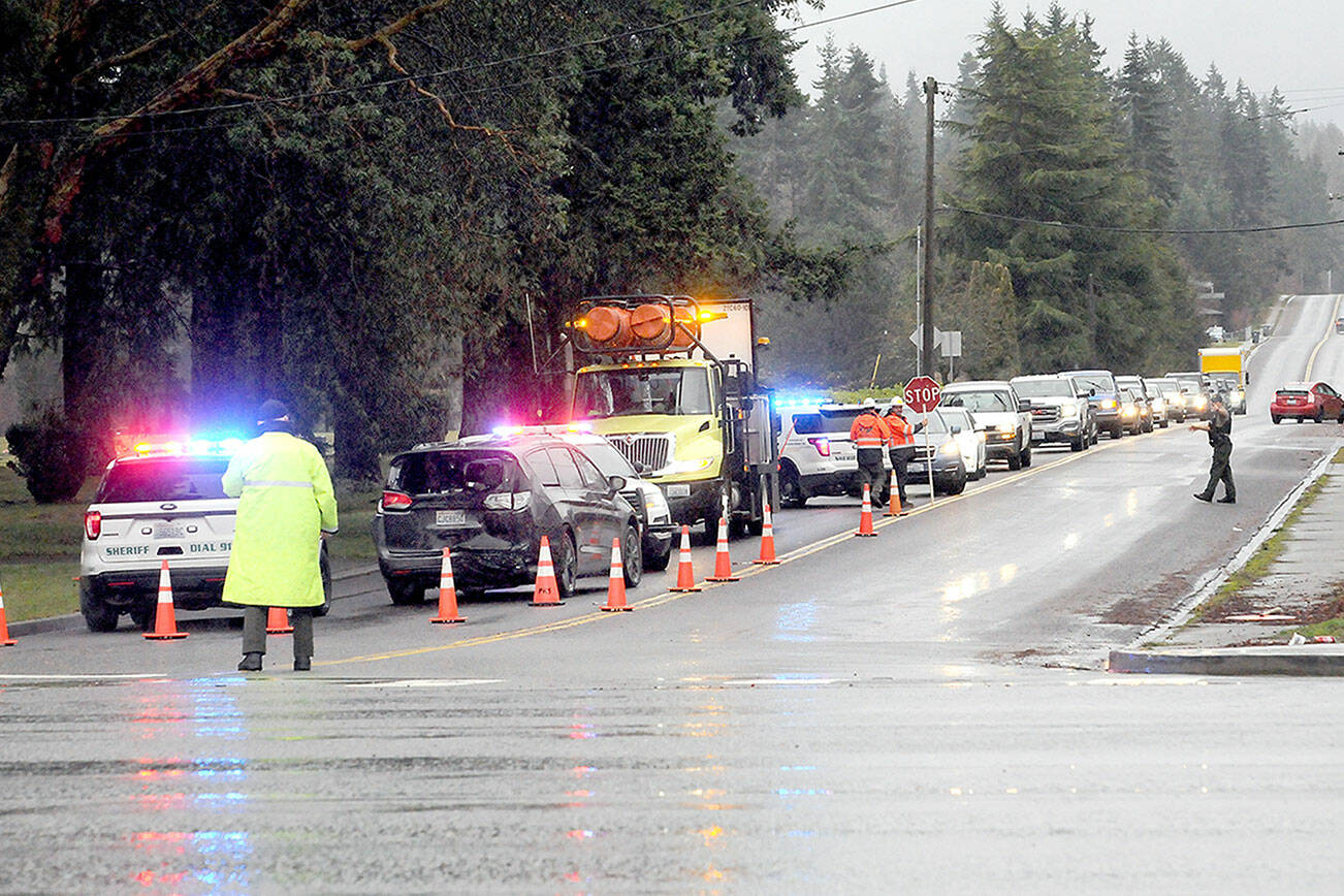 Traffic backs up on Monroe Road because of an automobile wreck near the intersection with U.S. Highway 101 on Thursday. (Keith Thorpe/Peninsula Daily News)