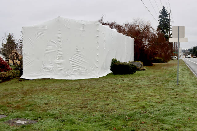 DAVE LOGAN/FOR PENINSULA DAILY NEWS Engine #4 is covered in a tarp in preparation for asbestos removal, which will be followed by restoration.