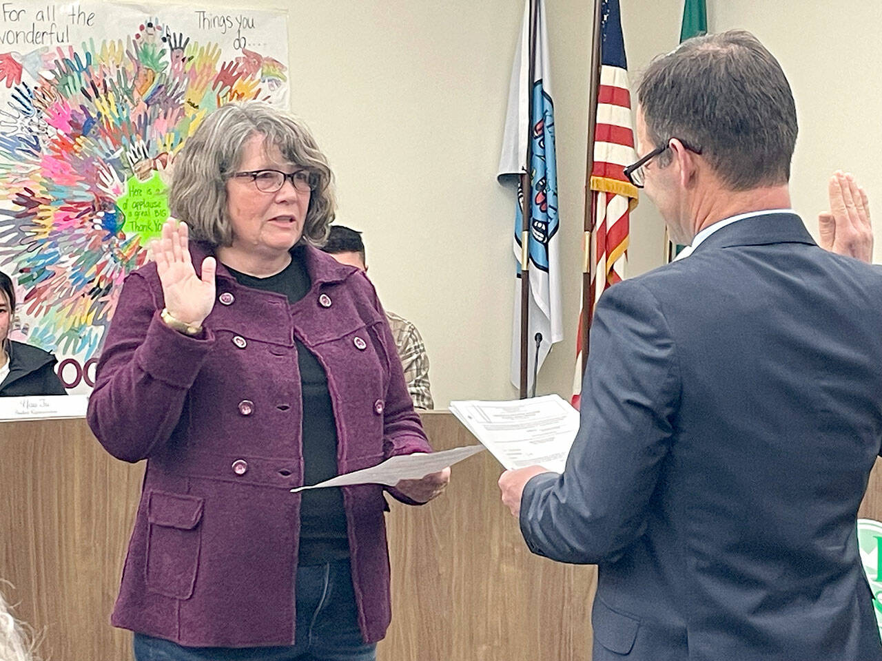 Kirsten Williams, left, was one of three Port Angeles School Board members sworn in by Clallam County Superior Court Judge Simon Barnhart on Dec. 14. Stan Williams (no relation) and Sandy Long also took the oath at the board’s meeting. (Paula Hunt/Peninsula Daily News)