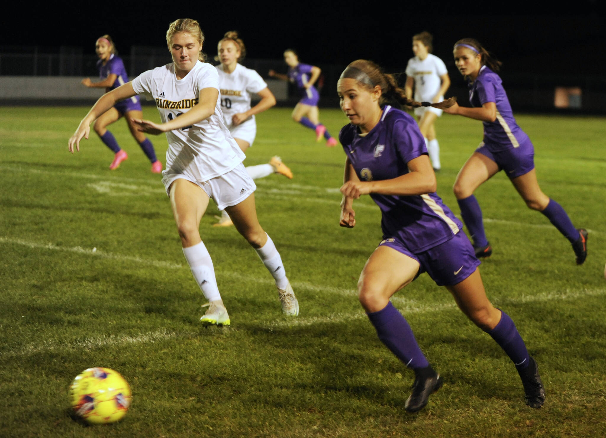 With teammate Sasha Yada, left, racing into Spartan territory, Sequim’s Taryn Johnson looks to advance the ball against Bainbridge in the first half of a Sept. 26 Olympic League match-up. Johnson has been selected as the Peninsula Daily News’ All-Peninsula Girls Soccer MVP for the second straight season.
Michael Dashiell/Olympic Peninsula News Group