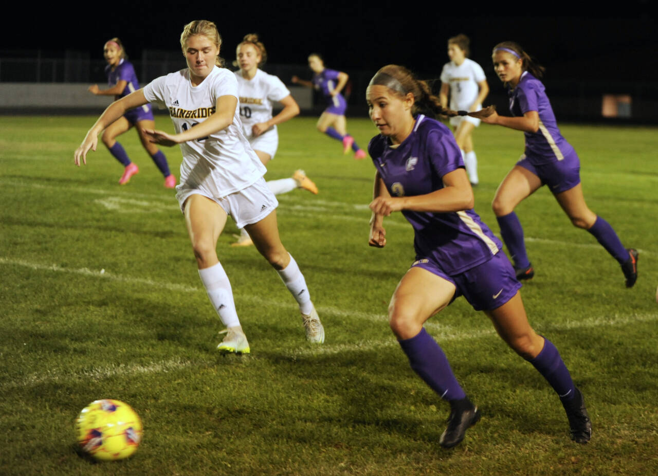 With teammate Sasha Yada, left, racing into Spartan territory, Sequim’s Taryn Johnson looks to advance the ball against Bainbridge in the first half of a Sept. 26 Olympic League match-up. Johnson has been selected as the Peninsula Daily News’ All-Peninsula Girls Soccer MVP for the second straight season.
Michael Dashiell/Olympic Peninsula News Group