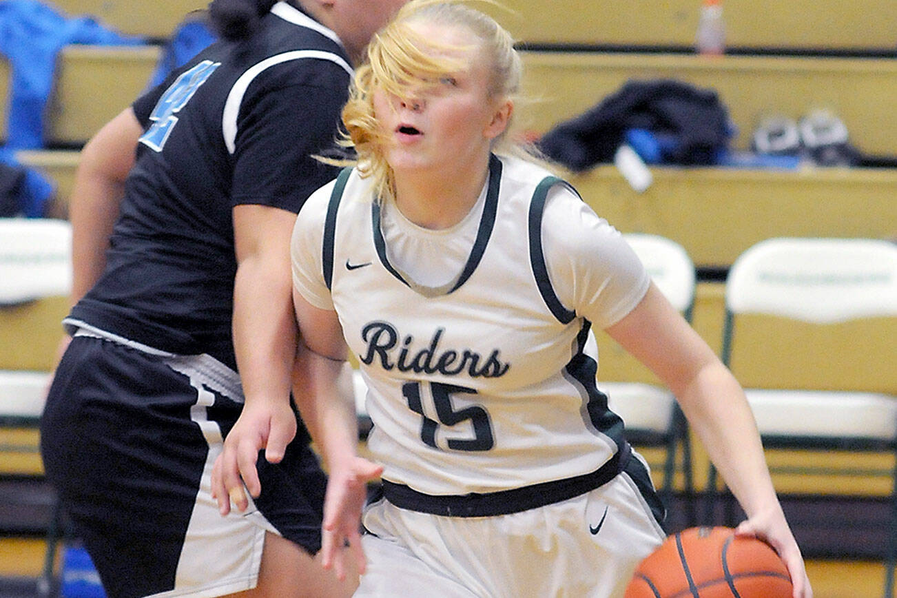 KEITH THORPE/PENINSULA DAILY NEWS 
Port Angeles' Paige Mason, front, steps into the lane past the defense of North Mason's Tanza Tupolo on Thursday at Port Angeles High School.