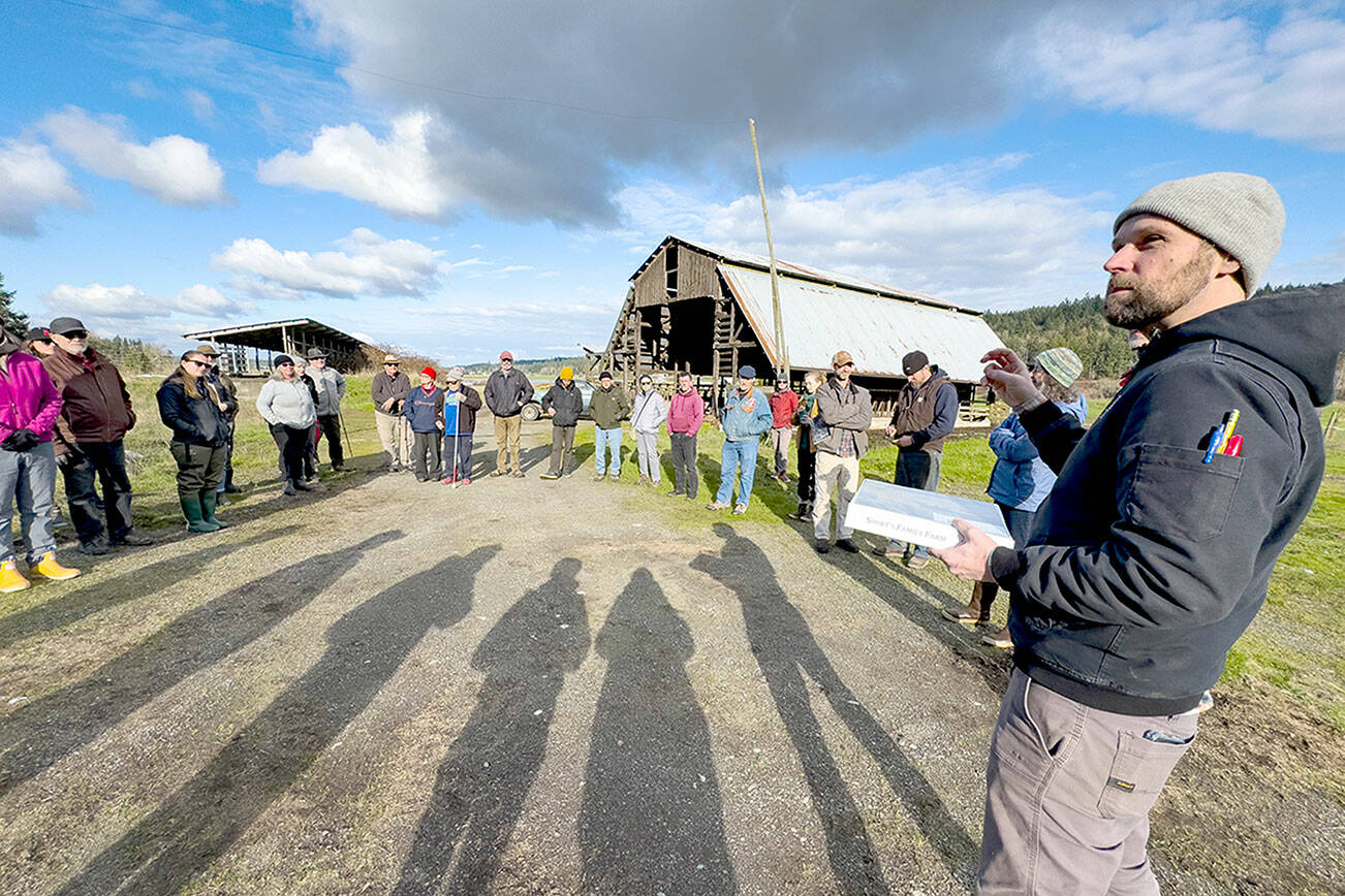 Steve Mullensky/for Peninsula Daily News

Erik Kingfisher, Stewardship Director of Jefferson Land Trust, explains the role of the trust after the sale of the Shorts Family Farm is completed to the Port of Port Townsend to an assembly of port commissioners and interested parties during a tour on Wednesday.