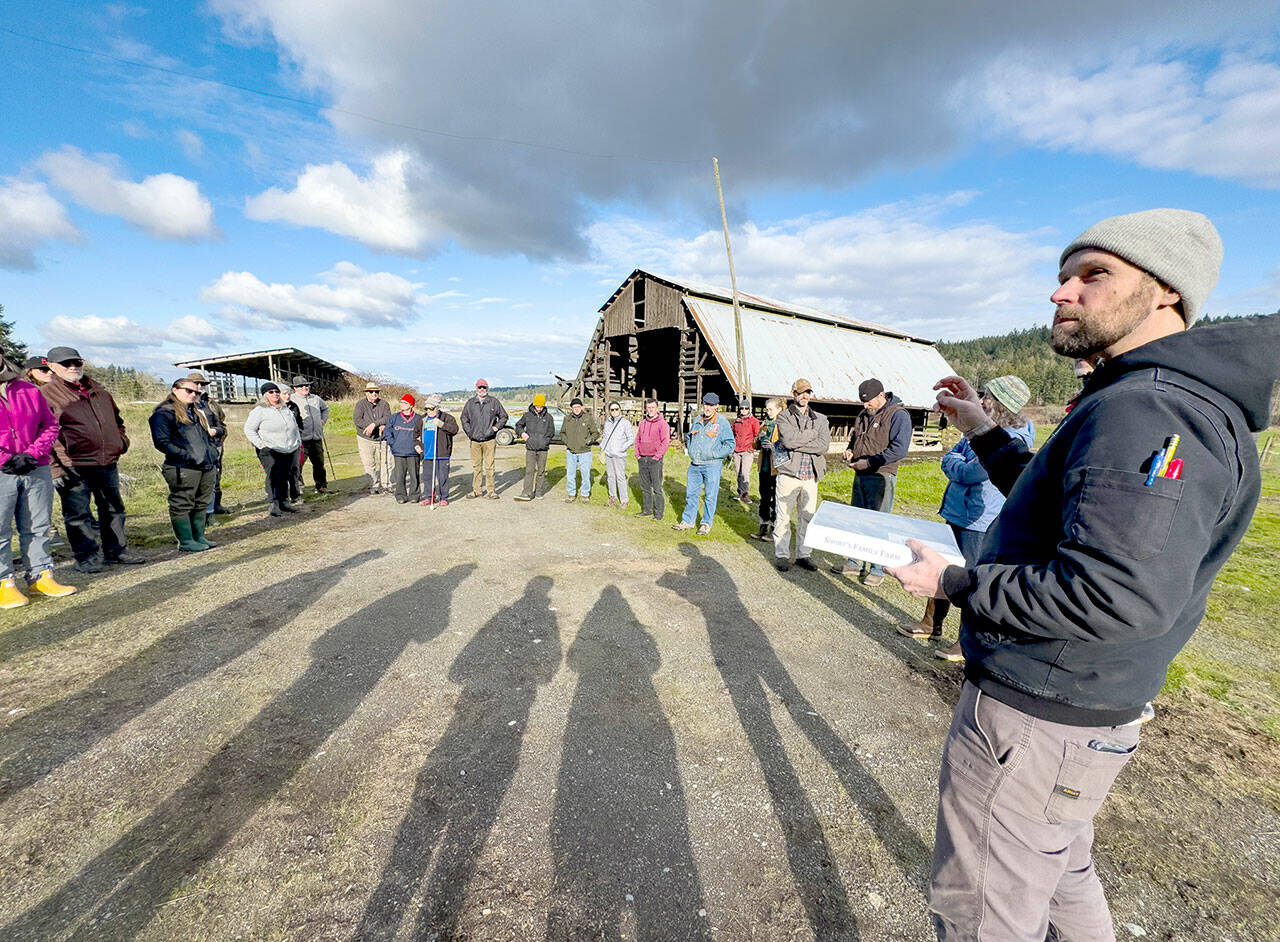 Erik Kingfisher, Stewardship Director of Jefferson Land Trust, explains the role of the trust after the sale of the Short’s Family Farm is completed to the Port of Port Townsend to an assembly of port commissioners and interested parties during an orientation on Wednesday. (Steve Mullensky/for Peninsula Daily News)