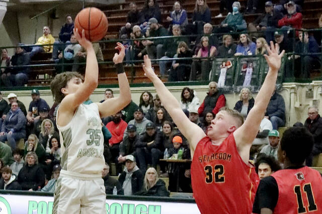 Dave Logan/for Peninsula Daily News 

Port Angeles’ Parker Nickerson rises to shoot while defended by Steilacoom’s Chace McSherry during the Roughriders’ come-from-behind 63-49 bi-district tournament victory Thursday night. Port Angeles will face Enumclaw today [Saturday] in a winner-to-state, loser-out contest at 4 p.m. at Foster High School in Tukwila. For more information, see Page B1.