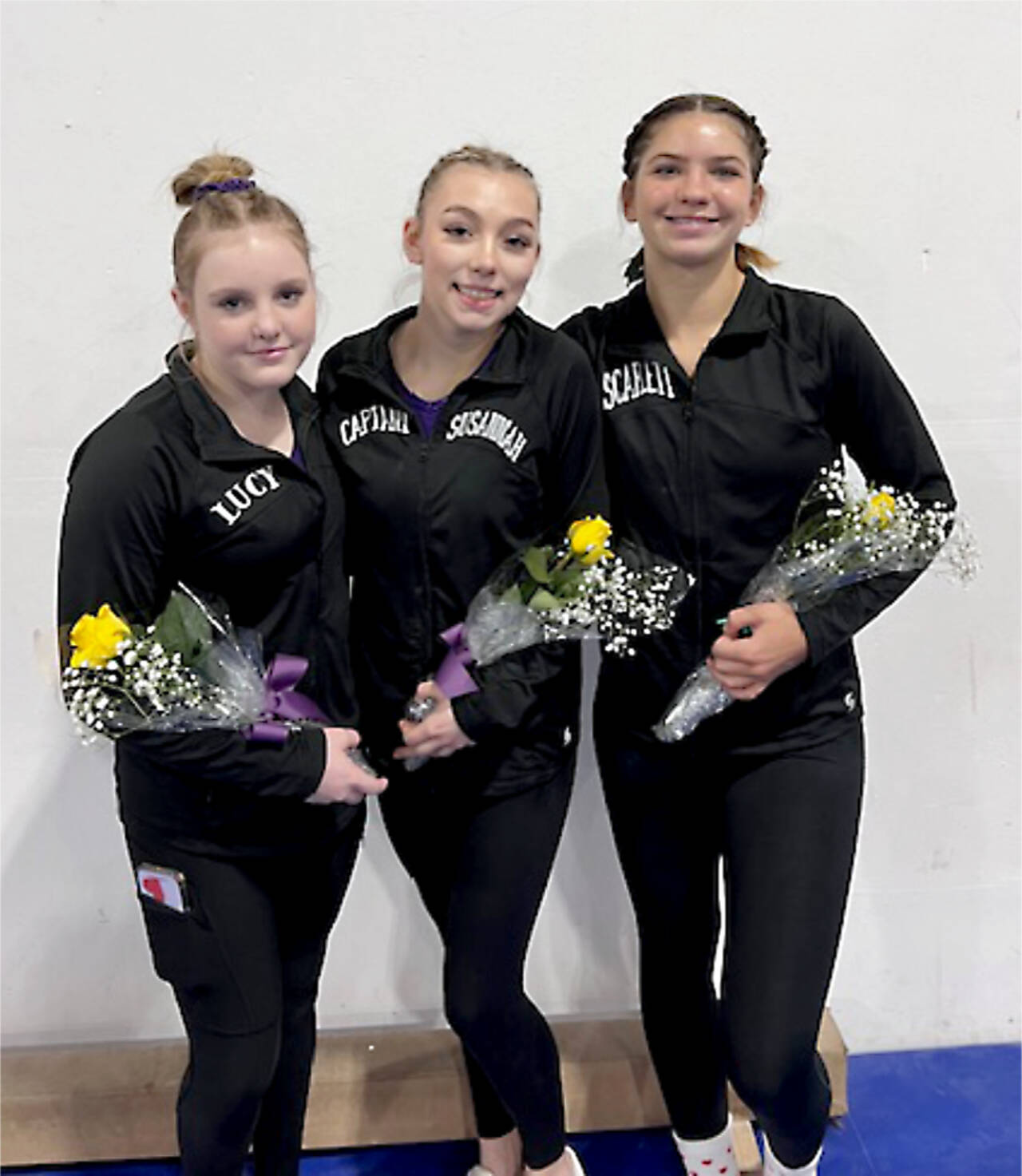 From left, Sequim’s Lucy Spelker and Susannah Sharp and Port Angeles’ Scarlett Sullivan all qualified for the state gymnastics meet Friday. (Courtesy photo)