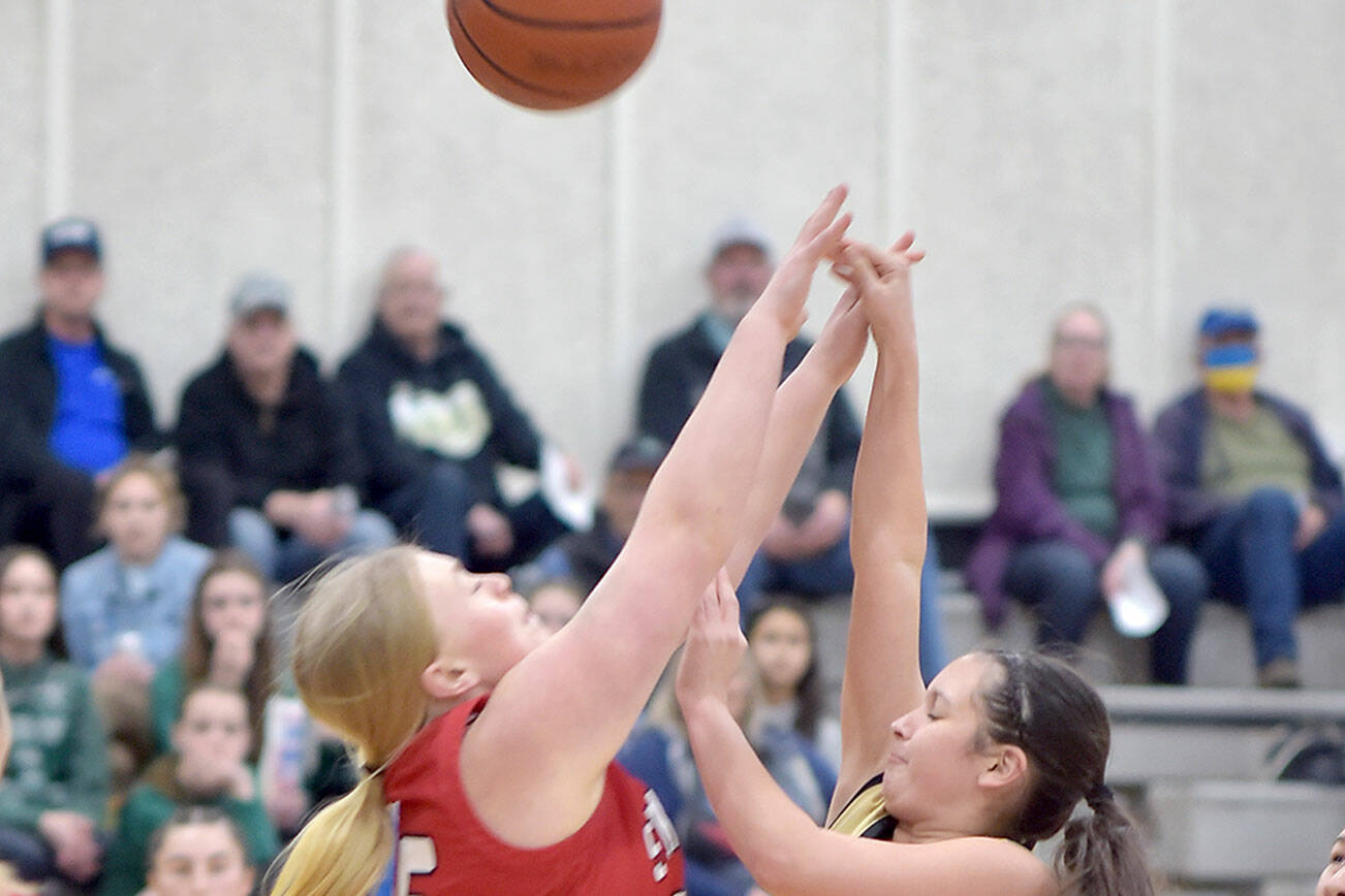 KEITH THORPE/PENINSULA DAILY NEWS
Peninsula's Allie Greene, right, puts the ball up over Skagit Valley's Madisyn Butenschoen on Wednesday on the Pirate home court in Port Angeles.