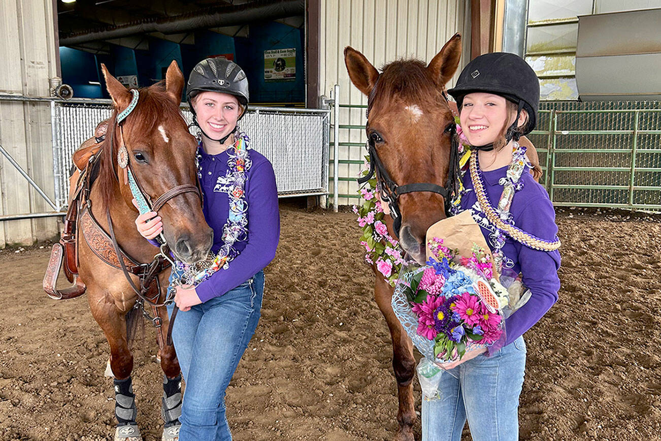 Libby Swanberg and Sydney Hutton took part in the Senior Salute, which lauds the accomplishments of graduating high school seniors and bids them a successful future. (Photo by Katie Salmon-Newton)