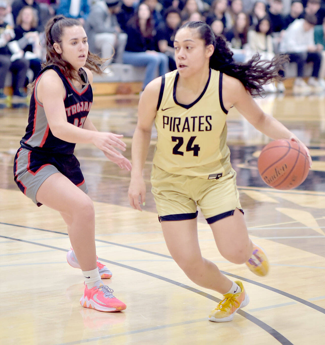Peninsula’s Shania Moananu, right, crosses the 3-point line as Everett’s Ashlynd Hunt tries to keep up in a Feb. 28 game at Peninsula College. Moananu, a point guard, was named the North Region MVP and freshman of the year. (Keith Thorpe/Peninsula Daily News)