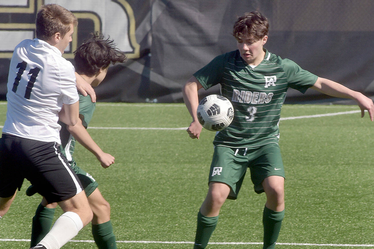 KEITH THORPE/PENINSULA DAILY NEWS
Port Angeles' Myles Close, right, settles a loose ball as Klahowya's Sage Bell, left, tries to get past Close's teammate Mason Spangler on Saturday in Port Angeles.