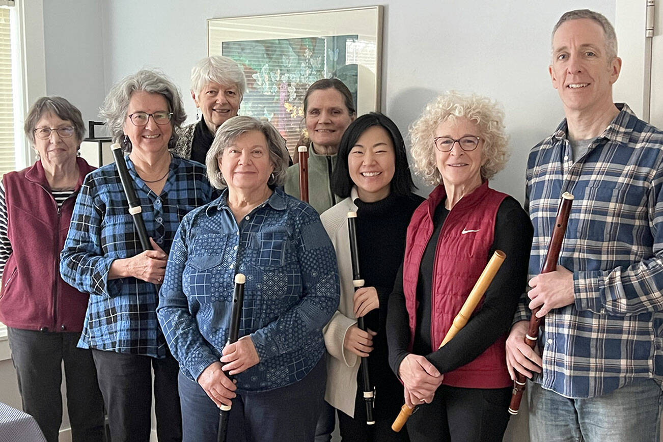 From left to right are flutists Mary Ann Hagan, Janet See, Molly Warner, Marty Ronish, Liz Hunter, Nayoung Ham, Carla Lawrence and Miguel Rodé.