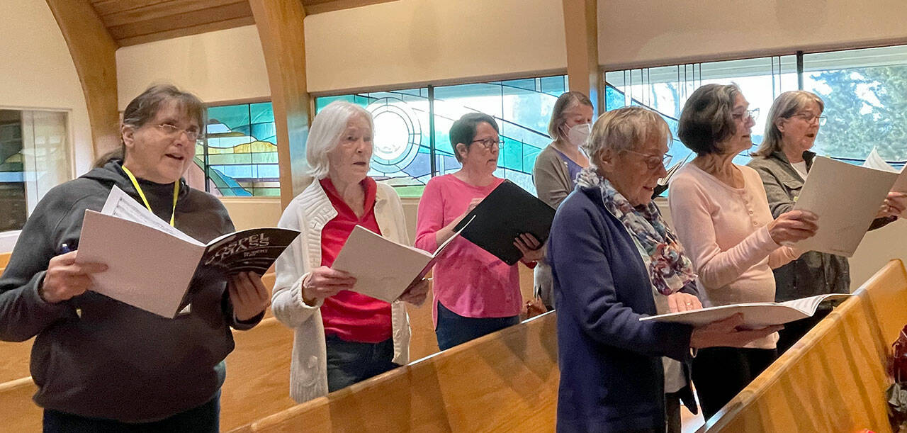 Sopranos rehearsing, back row, from left, Beth Cahape, Annalee McConnell, Joan Coyne and Amy Johnson; front row, from left, Judy Backman, Mardelle Hansen and Mar Oneppo.