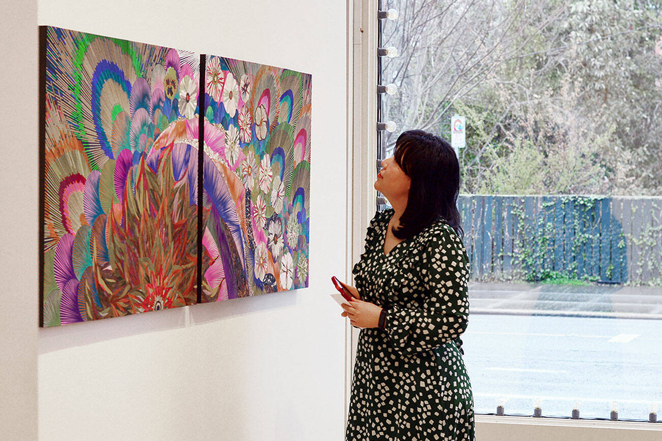 Xin Xin admires mosaics by fellow “A Warm Embrace” artist Naoko Morisawa at Jeanette Best Gallery in downtown Port Townsend. (Northwind Art)